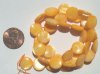 16 inch strand of 10mm Orange Mother of Pearl Disks